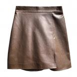Falda corta de cuero Pu de cintura alta estilo Otoño Invierno 2023 faldas acampanadas irregulares con diseño versátil