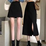 Faldas negras de media pantorrilla para mujer, faldas universitarias de corte A, estilo de cintura alta, ropa de calle que combi