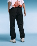 Pantalones deportivos sueltos de estilo caído con buen diseño para hombre