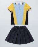 Ensemble de vêtements de sport pour enfants de style preppy avec chemise à revers bleu et jupe et short