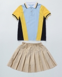 Conjunto de ropa deportiva para niños estilo preppy con camisa de solapa azul y pantalones cortos de falda