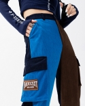 Calça feminina de veludo cotelê estilo novo estilo cor contrastante folgada com vários bolsos
