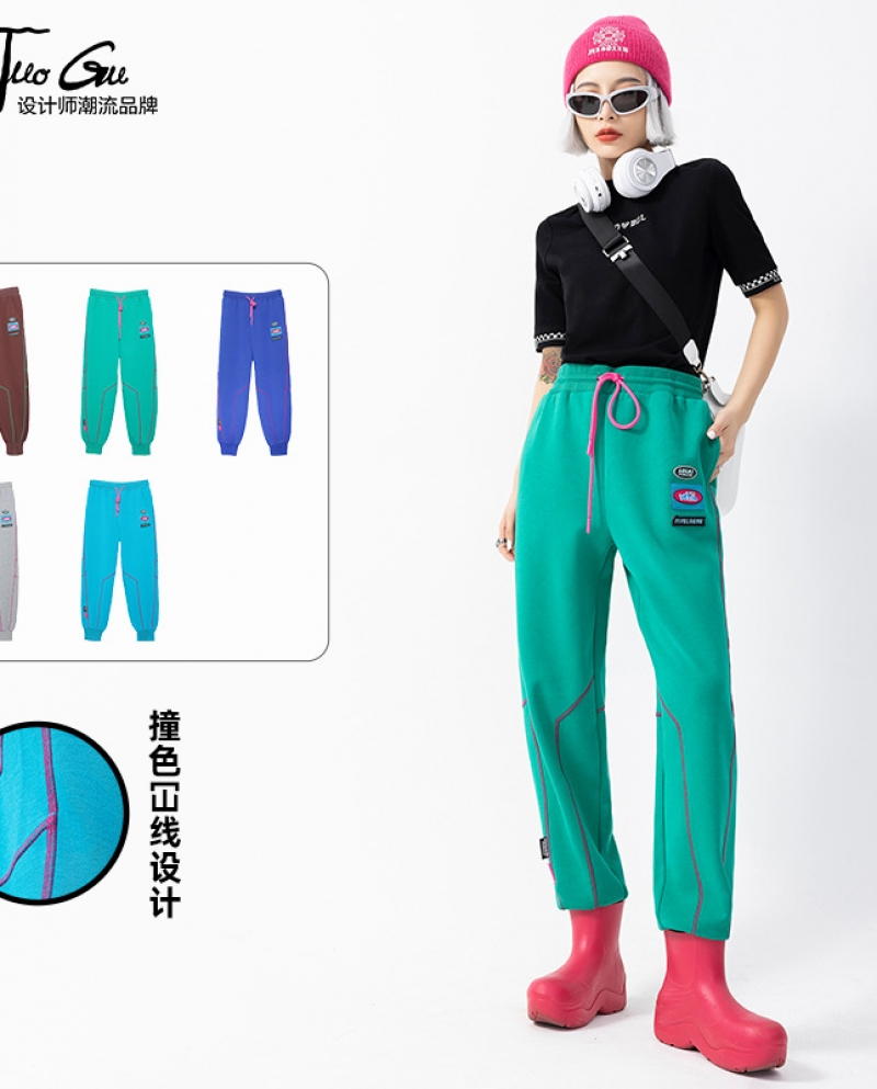מותג tuogu tide לנשים 200 סתיו וחורף חדש בצבע סוכריות מכנסי טרנינג משוחררים בעיצוב קו נשים פאן קזואל ארוז