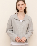 Suéter de cuello de polo de color sólido de empalme de algodón de terciopelo fino suelto de manga larga de otoño e invierno para