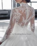 Luxury High End Shiny Arab Lace Applique Wedding Dress Back Button Design Transparent Tulle Long Sleeve High Neck Dubai 