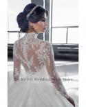 Luxury High End Shiny Arab Lace Applique Wedding Dress Back Button Design Transparent Tulle Long Sleeve High Neck Dubai 